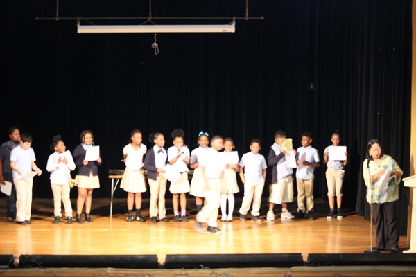 Mrs. Seriosa's students receive their honor roll certificates.